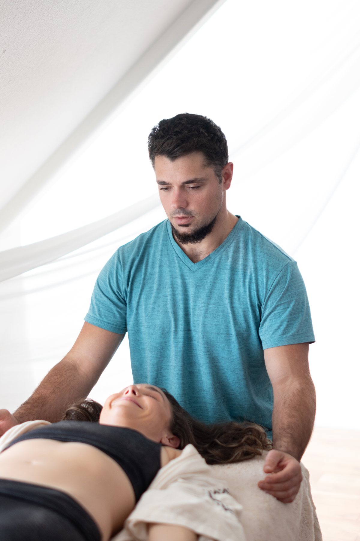 Male practitioner working with a retreat participant
